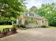 Charming home exterior featuring a well-manicured yard, a garage, and a driveway at 6673 Nc 96 W Hwy, Youngsville, NC 27596
