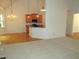 View of the kitchen showcasing pendant lighting and dark countertops at 6673 Nc 96 W Hwy, Youngsville, NC 27596