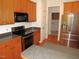 Kitchen featuring stainless steel appliances, wooden cabinets, and dark countertops at 6673 Nc 96 W Hwy, Youngsville, NC 27596