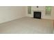 Bright living room featuring a fireplace and carpeted floors at 6673 Nc 96 W Hwy, Youngsville, NC 27596