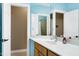 Well-lit bathroom with a modern vanity, mirror, and a view of the shower through the mirror at 754 Olde Thompson Creek Ct Rd, Apex, NC 27523