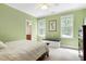 A bright bedroom featuring two windows, light green walls, and a bed with a white comforter at 754 Olde Thompson Creek Ct Rd, Apex, NC 27523