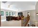 Bonus room with natural light, comfortable seating, and ceiling fans at 754 Olde Thompson Creek Ct Rd, Apex, NC 27523
