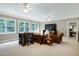 Bonus room with natural light, comfortable seating, and a chess set at 754 Olde Thompson Creek Ct Rd, Apex, NC 27523