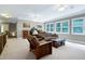Bright bonus room with lots of natural light and a comfy seating area at 754 Olde Thompson Creek Ct Rd, Apex, NC 27523