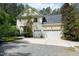 Charming home with a three-car garage, traditional design, and mature trees at 754 Olde Thompson Creek Ct Rd, Apex, NC 27523