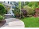 Charming home with landscaped yard, inviting front porch, and well-maintained exterior at 754 Olde Thompson Creek Ct Rd, Apex, NC 27523