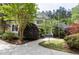 Charming home with well-maintained landscaping, lush trees, and a welcoming driveway at 754 Olde Thompson Creek Ct Rd, Apex, NC 27523