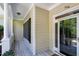 Inviting front porch features classic columns and a stylish entrance door with sidelights, enhancing curb appeal at 754 Olde Thompson Creek Ct Rd, Apex, NC 27523