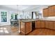 Bright breakfast nook off of the kitchen with large windows overlooking the backyard at 754 Olde Thompson Creek Ct Rd, Apex, NC 27523
