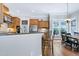 Open kitchen and dining area featuring granite countertops and stainless steel appliances at 754 Olde Thompson Creek Ct Rd, Apex, NC 27523