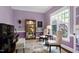 Cozy room with piano, chairs, and large window providing natural light, perfect for relaxation and entertainment at 754 Olde Thompson Creek Ct Rd, Apex, NC 27523