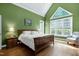 Main bedroom with a cathedral ceiling, large windows, and gleaming hardwood floors at 754 Olde Thompson Creek Ct Rd, Apex, NC 27523