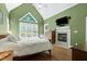 Spacious main bedroom with vaulted ceiling, fireplace, and ample natural light at 754 Olde Thompson Creek Ct Rd, Apex, NC 27523