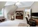 A home office featuring built in storage, a window, and desk with a chair and bookshelf at 754 Olde Thompson Creek Ct Rd, Apex, NC 27523