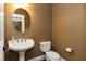 Cozy powder room with pedestal sink and classic fixtures at 754 Olde Thompson Creek Ct Rd, Apex, NC 27523