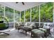 Relaxing screened porch with comfortable seating and tranquil views of the backyard at 754 Olde Thompson Creek Ct Rd, Apex, NC 27523