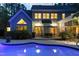 Back of house with large in-ground swimming pool, an outdoor dining set, and a screened-in porch at 754 Olde Thompson Creek Ct Rd, Apex, NC 27523