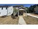 Rear view of a charming two-story home with a covered porch and landscaped backyard at 773 Portland Rose Dr, Knightdale, NC 27545