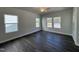 Spacious bedroom showcasing modern flooring, neutral walls, and plenty of natural light from the windows at 773 Portland Rose Dr, Knightdale, NC 27545
