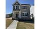 Charming new construction home with a two-tone exterior and inviting covered front porch at 773 Portland Rose Dr, Knightdale, NC 27545