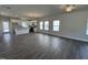 Bright and airy living room featuring modern flooring, recessed lights, and plenty of natural light at 773 Portland Rose Dr, Knightdale, NC 27545
