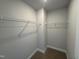Spacious walk-in closet ready for organization with sturdy wire shelving, offering ample storage at 773 Portland Rose Dr, Knightdale, NC 27545