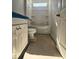 Compact bathroom with a toilet, tub/shower combo, and vanity cabinet at 79 Mildred Dr, Broadway, NC 27505