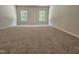 Spacious bedroom featuring neutral paint, plush carpet and double window views at 79 Mildred Dr, Broadway, NC 27505