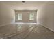 Spacious bedroom with two windows offering natural light and outdoor views at 79 Mildred Dr, Broadway, NC 27505