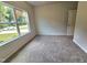 Bright bedroom with plush carpeting and natural light streaming through a large window at 79 Mildred Dr, Broadway, NC 27505