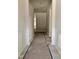 A clean and bright hallway showcasing decorative wall trim and new hardwood floors at 79 Mildred Dr, Broadway, NC 27505