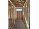 Framed hallway with exposed framing and natural light at 79 Mildred Dr, Broadway, NC 27505