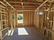 View of interior framing showcasing the layout and window placement in the home under construction at 79 Mildred Dr, Broadway, NC 27505