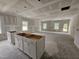 Unfinished kitchen area featuring ample counter space and natural light from windows at 79 Mildred Dr, Broadway, NC 27505