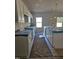 Well-lit kitchen with granite countertops, modern white cabinets, and stainless steel appliances at 79 Mildred Dr, Broadway, NC 27505