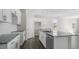 This kitchen has new stainless steel appliances, granite countertops, white cabinets, and ample counter space at 832 Old Tarboro Rd, Wendell, NC 27591