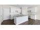 Gourmet kitchen showcases white cabinetry, granite countertops, subway tile backsplash, and a large island at 832 Old Tarboro Rd, Wendell, NC 27591