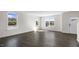 Inviting living room with wood-look flooring has an abundance of natural light from the multiple windows at 832 Old Tarboro Rd, Wendell, NC 27591
