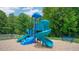 Blue playground with multiple slides and climbing features at 832 Old Tarboro Rd, Wendell, NC 27591