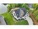 Aerial view of a home with landscaping, and a long driveway in a green neighborhood at 833 Dunleigh Dr, Burlington, NC 27215