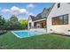 Expansive backyard featuring a refreshing swimming pool and well-manicured lawn at 833 Dunleigh Dr, Burlington, NC 27215