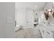 A look from the bathroom into the bedroom with a marble shower and a standalone tub at 833 Dunleigh Dr, Burlington, NC 27215