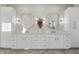 Stylish bathroom featuring a dual vanity, white cabinets, gold hardware, and modern mirrors at 833 Dunleigh Dr, Burlington, NC 27215