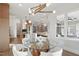 Elegant dining room with modern chandelier, a glass table, and an open view into the kitchen at 833 Dunleigh Dr, Burlington, NC 27215