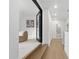 Hallway leading to a sitting area with elegant hardwood floors at 833 Dunleigh Dr, Burlington, NC 27215