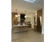 Modern kitchen with island, stainless steel appliances, stylish cabinetry, and hardwood floors at 833 Dunleigh Dr, Burlington, NC 27215