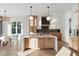 Stunning kitchen with a large island, modern cabinets, and stainless steel appliances adjacent to a dining area at 833 Dunleigh Dr, Burlington, NC 27215