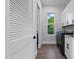 Functional laundry room featuring modern appliances, white cabinets, and ample counter space at 833 Dunleigh Dr, Burlington, NC 27215