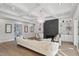 Open-concept living room with coffered ceiling, modern fireplace, and built-in shelving at 833 Dunleigh Dr, Burlington, NC 27215